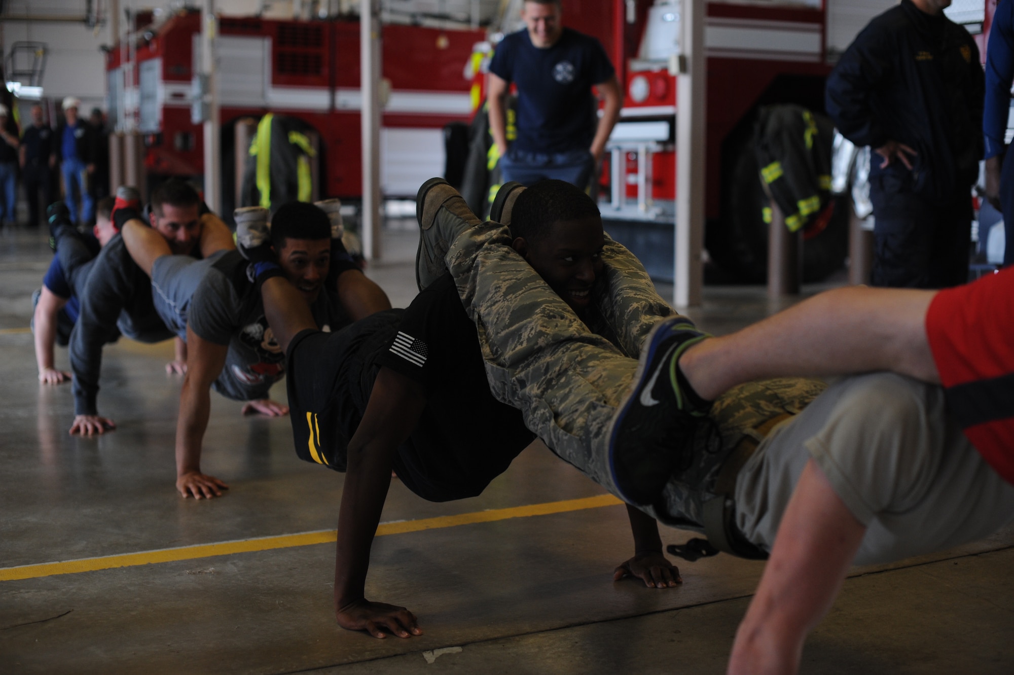 The 22nd Security Forces Squadron defenders and the 22nd Civil Engineer Squadron firefighters went head-to-head during the Battle of the Badges, May 19, 2016, at McConnell Air Force Base, Kan. Over the course of the day, the two groups competed in weightlifting, dodgeball, a fit challenge, basketball and flag football. (U.S. Air Force photos by Airman 1st Class Jenna K. Caldwell)