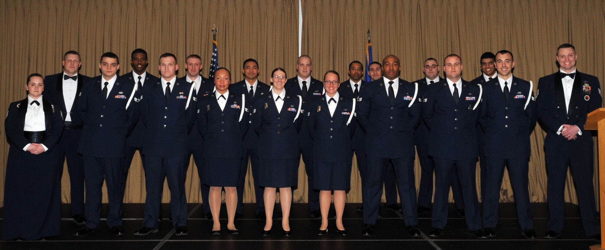 Tech. Sgt. Chelsea Roberts (far left, front row), 319th Force Support Squadron Airman Leadership School instructor, poses in a group photo with a graduating ALS class on Grand Forks Air Force Base, N.D., March 24, 2016. (Courtesy photo)