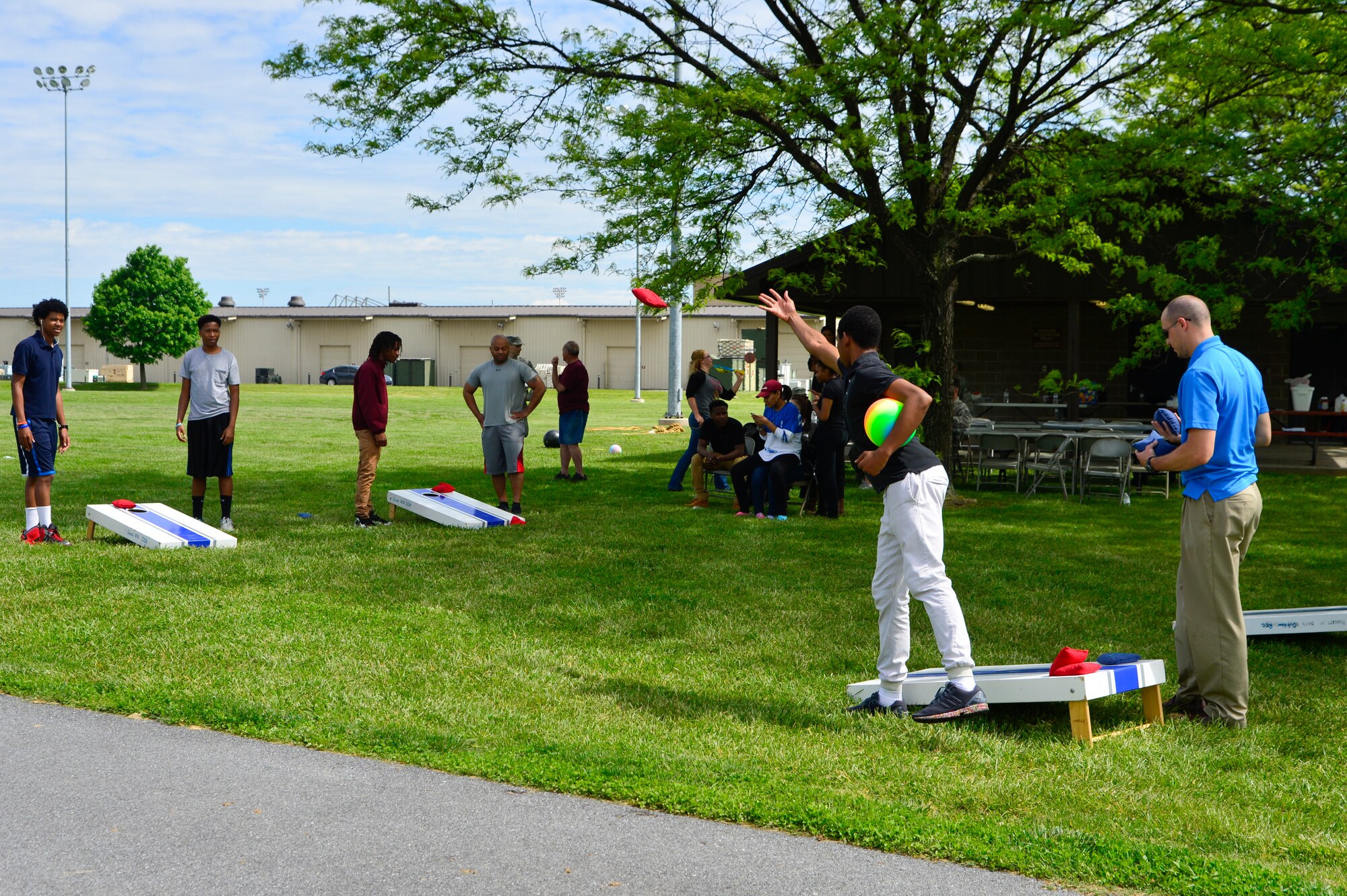 Team Dover mentors and students from the Communities in School program enjoy a host of outdoor activities and a barbeque during their last phase mentoring session May 19, 2016, at Dover Air Force Base, Del. CIS is a program that focuses on future career development and community involvement.   (U.S. Air Force photo/Senior Airman William Johnson)