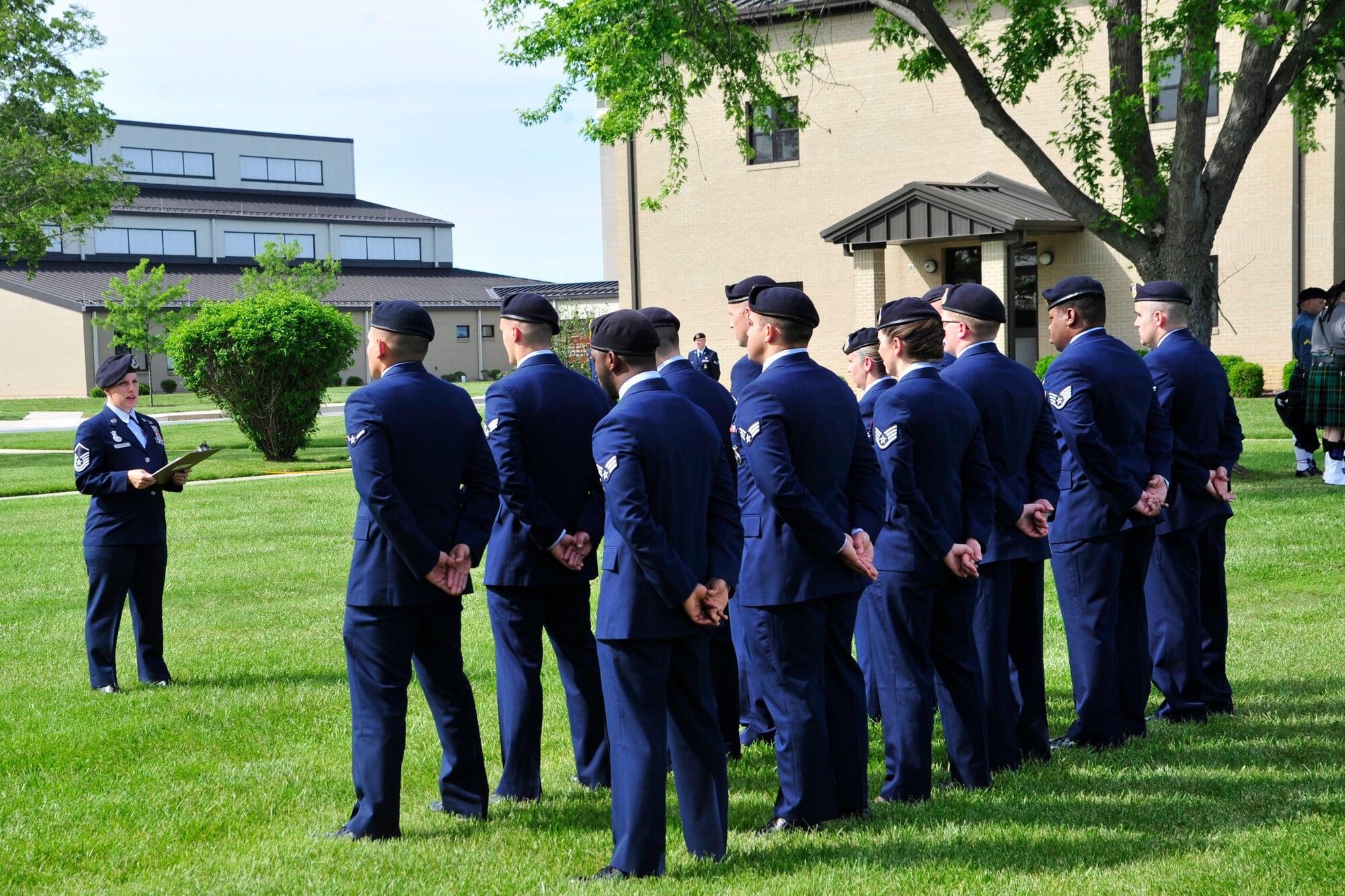 Master Sgt.Sally Wihera, 436th Security Forces Squadron Installation Security NCO in charge, announces names of fallen security forces Airmen and Office of Special Investigation agents during a retreat ceremony May 20, 2016, outside of the 436th Airlift Wing headquarters building on Dover Air Force Base, Del. There have been 12 security forces defenders and 14 OSI agents that have made the ultimate sacrifice since the beginning of the Global War on Terror. (U.S. Air Force photo/Senior Airman William Johnson)