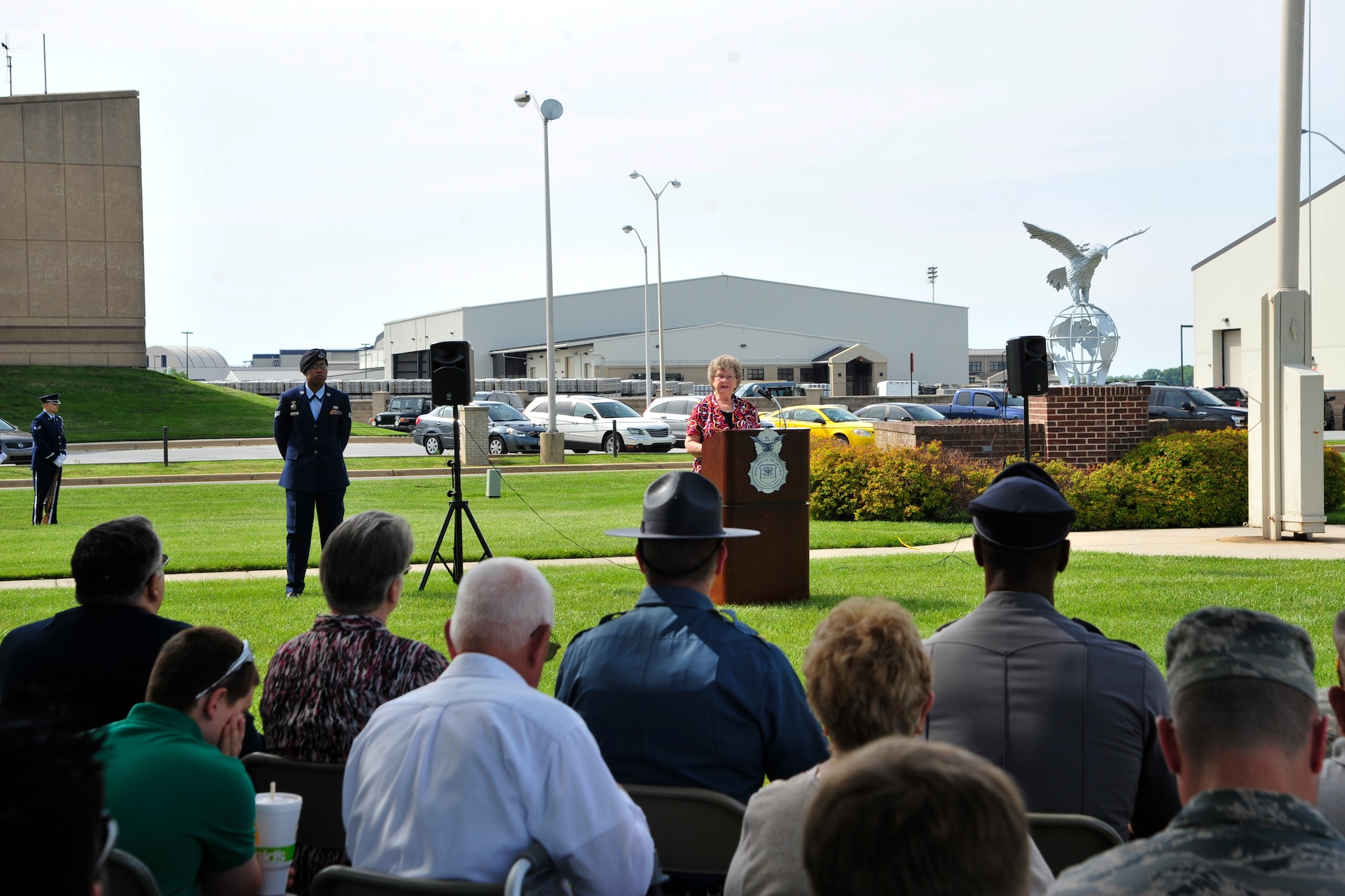 Eleanor Allione, Delaware Concerns of Police Survivors president, speaks to an audience at a retreat ceremony commemorating fallen military and civilian law enforcement officers May 20, 2016, outside of the 436th Airlift Wing headquarters building on Dover Air Force Base, Del. Allione’s daughter was a law enforcement officer who was struck and killed by a passing motorist when she stopped to help a broken down motor vehicle. (U.S. Air Force photo/Senior Airman William Johnson)