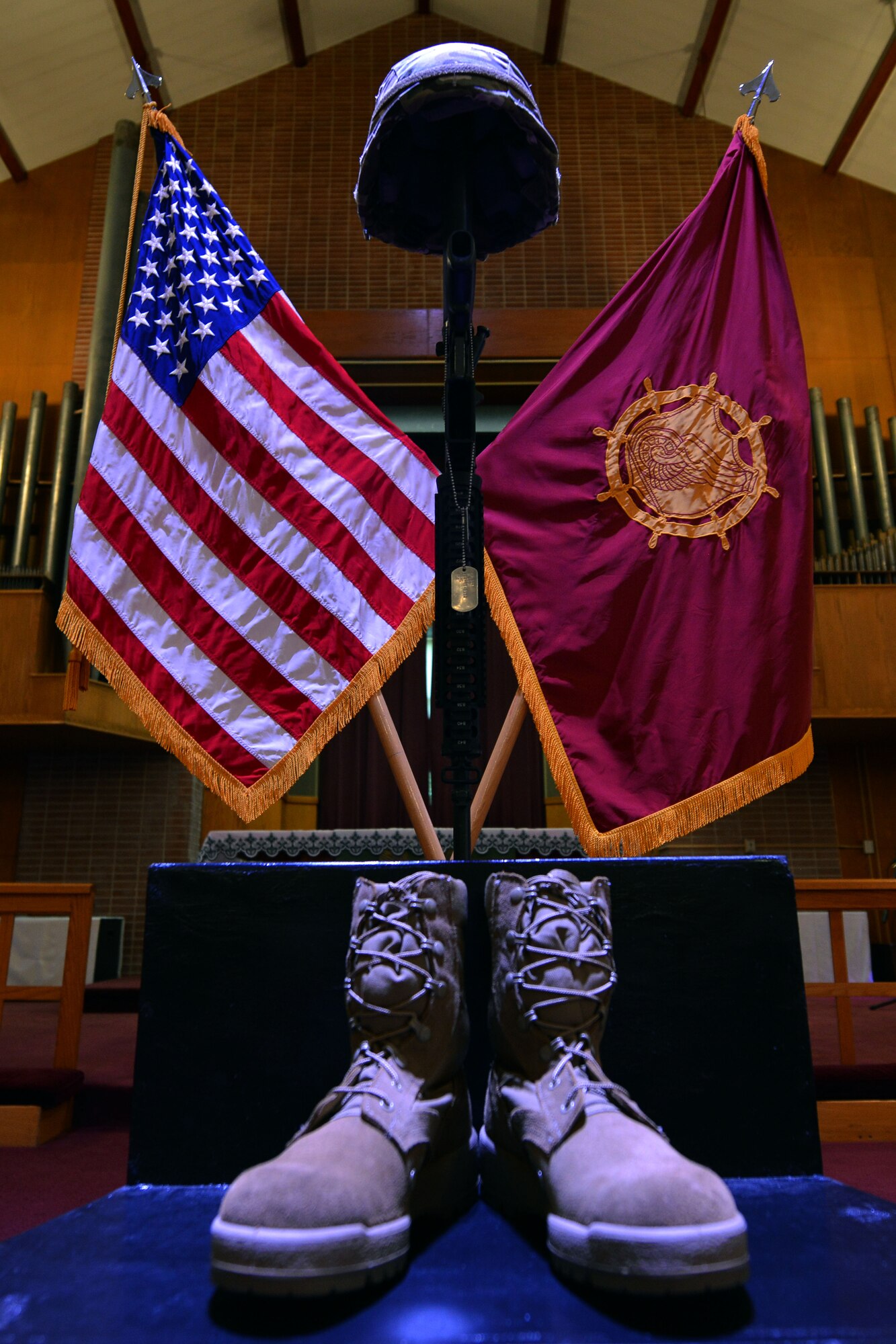 The battlefield cross is displayed during the U.S. Army Transportation Corps Wreath Laying Ceremony at Fort Eustis, Va., May 24, 2016.  The cross was displayed to honor U.S. Service members who lost their lives. (U.S. Air Force photo by Staff Sgt. Natasha Stannard)