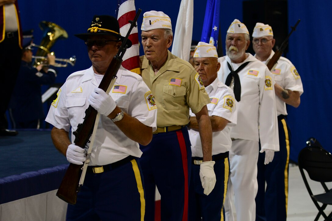 Members of Veterans of Foreign Wars Virginia honor guard, present the colors during a Vietnam War Commemoration ceremony at Langley Air Force Base, Va., May 18, 2016. The ceremony was the opening event to a three-day long, 50th anniversary of the Vietnam War. (U.S. Air Force photo by Staff Sgt. Ciara Gosier)  