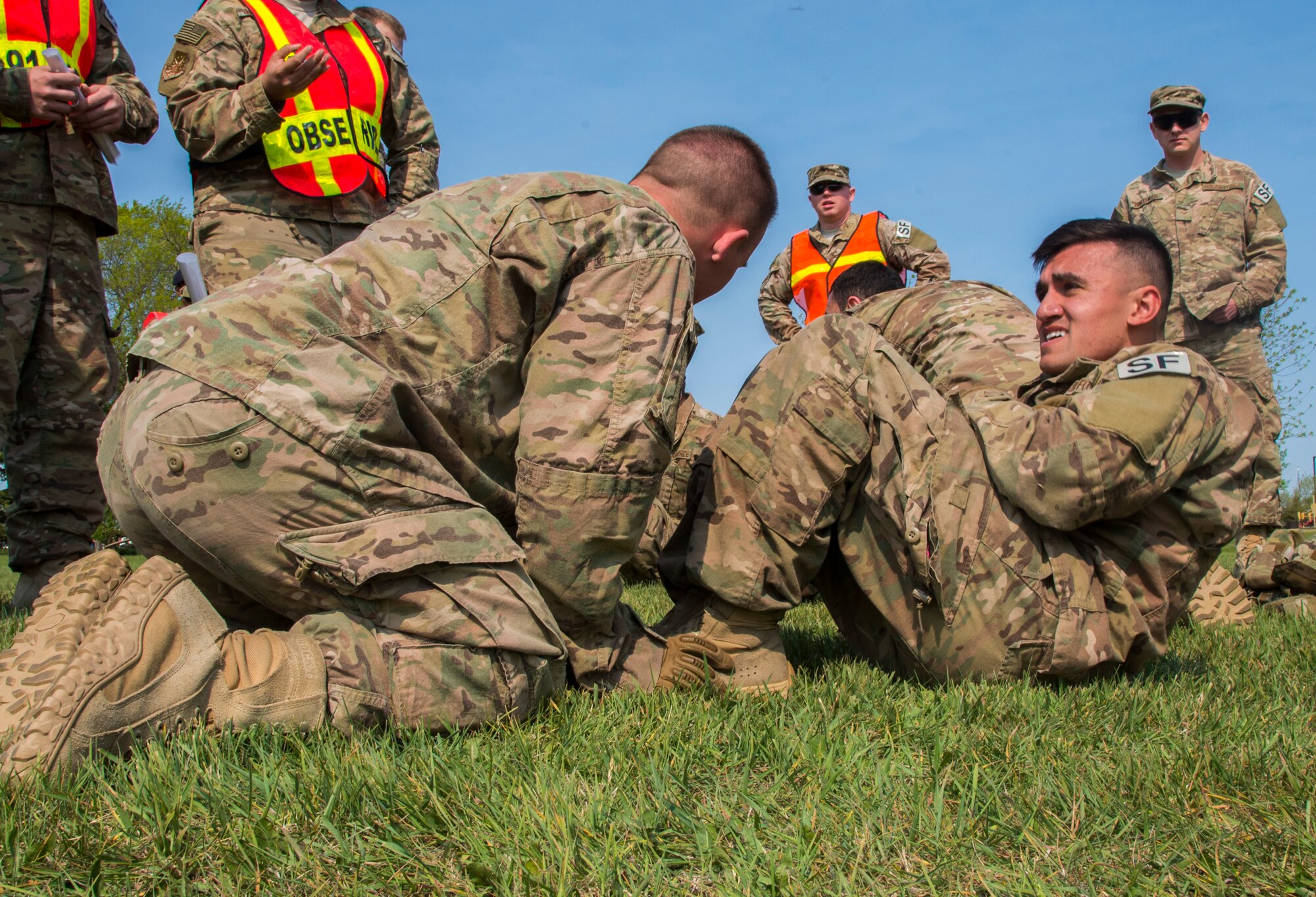 Airman 1st Class Seth La Bodda, 91st Missile Security Forces Squadron member, finishes a sit-up during the top cop challenge at Minot Air Force Base, N.D., May 18, 2016. The top cop challenge was one of many events held in honor of police week at Minot. (U.S. Air Force photo/Airman 1st Class Christian Sullivan)