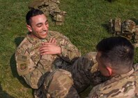 Airman 1st Class Carlos Lebron-Albino, 91st Missile Security Force Squadron member, finishes a sit-up during the top cop challenge at Minot Air Force Base, N.D., May 18, 2016. The top cop challenge was one of many events held in honor of police week at Minot. (U.S. Air Force photo/Airman 1st Class Christian Sullivan)