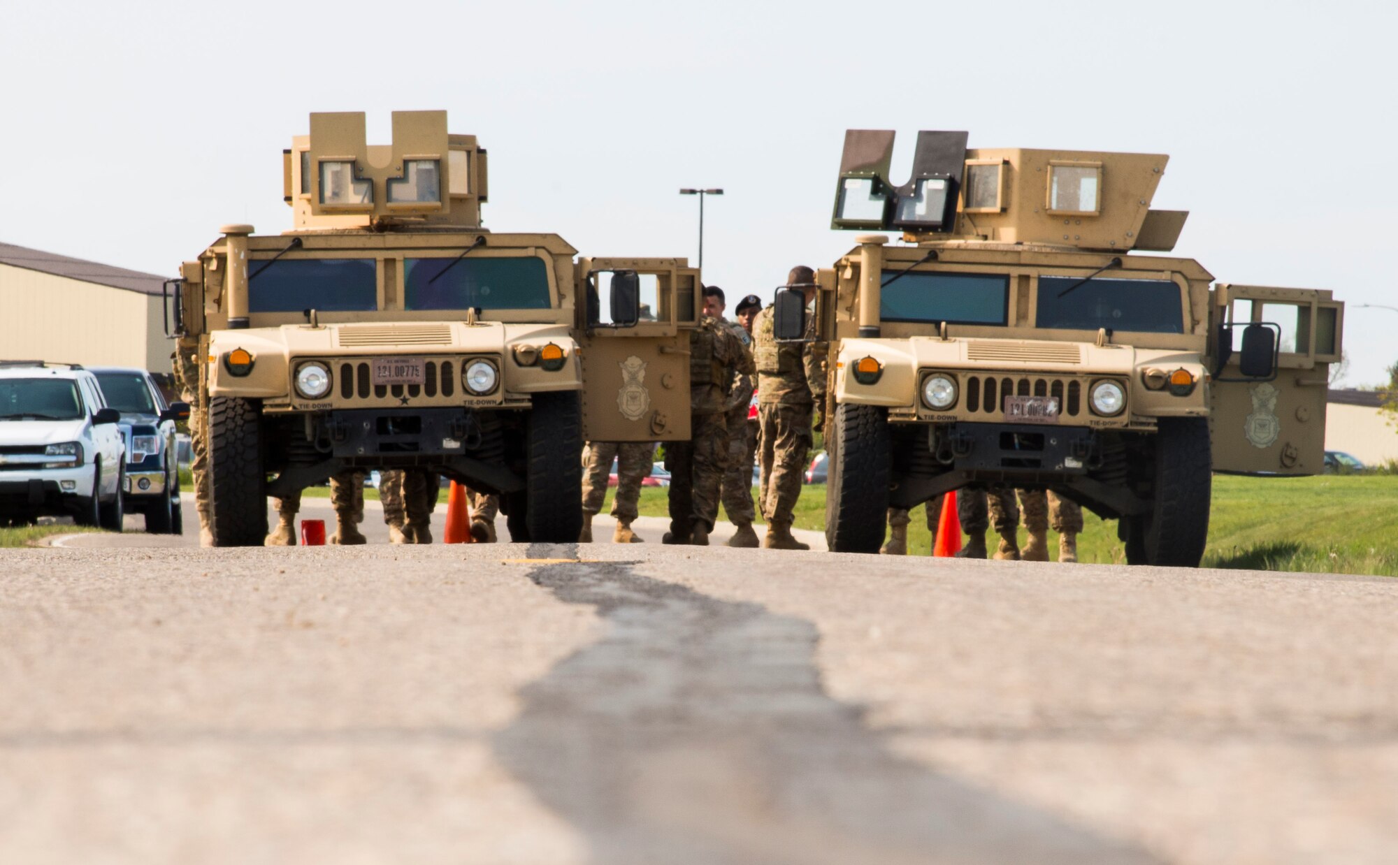 Security Forces members prepare to race in a Humvee push during the top cop challenge at Minot Air Force Base, N.D., May 18, 2016. During the challenge Airmen were tested physically and mentally as the raced to see who finished first. (U.S. Air Force photo/Airman 1st Class Christian Sullivan)
