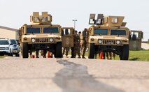 Security Forces members prepare to race in a Humvee push during the top cop challenge at Minot Air Force Base, N.D., May 18, 2016. During the challenge Airmen were tested physically and mentally as the raced to see who finished first. (U.S. Air Force photo/Airman 1st Class Christian Sullivan)