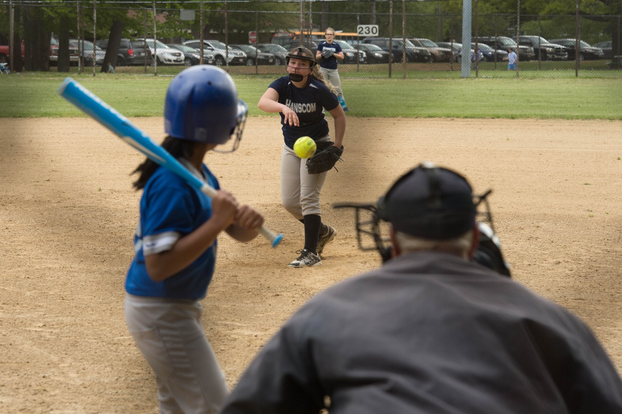 Leila Heller, a member of the Hansom Middle School Falcons girl's softball team, throws a pitch to a Lexington Clarke Middle School hitter during the team’s home game May 19. The Falcons won the game 17 to 5. (U.S. Air Force photo by Jerry Saslav)