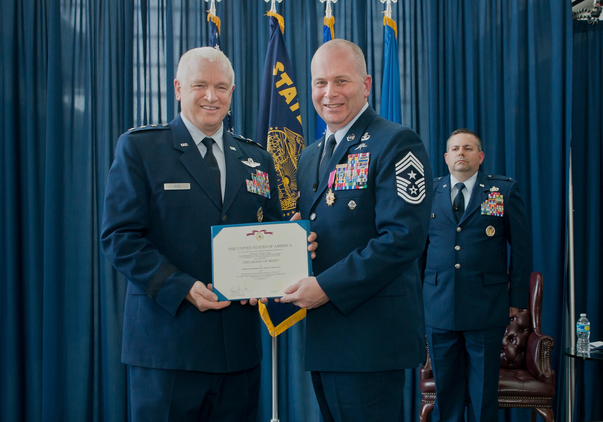 Lt. Gen. L. Scott Rice, director of the Air National Guard, presents Chief Master Sgt. James W. Hotaling, the 11th command chief master sergeant of the ANG, with the Legion of Merit during his retirement ceremony May 20, 2016, at Joint Base Andrews, Md. Hotaling retired after serving a combined 28 years in the Air Force, Air Force reserve, Air National Guard, and U.S. Coast Guard. (U.S. Air National Guard photo by Master Sgt. Marvin R. Preston/Released)