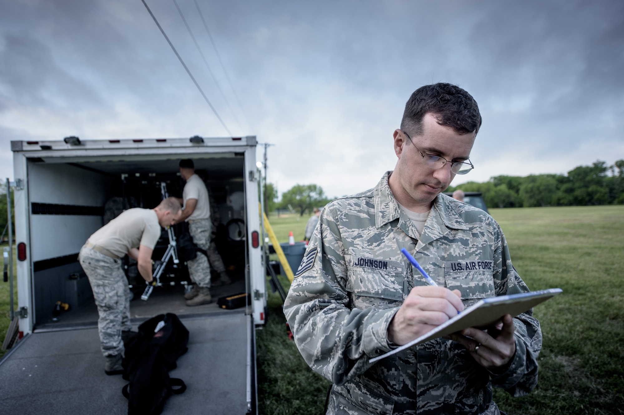 Tech. Sgt. Cory Johnson, 149th Force Support Squadron, Texas Air National Guard, headquartered at Joint Base San Antonio, takes notes during a training event at JBSA-Lackland, Texas, April 10, 2016. He is a member of the 149th FSS Fatality Search and Recovery Team.  These FSRT members are training on how to move into a contaminated area and recover remains after a chemical disaster. (U.S. Air National Guard photo by Tech. Sgt. Eric L. Wilson)