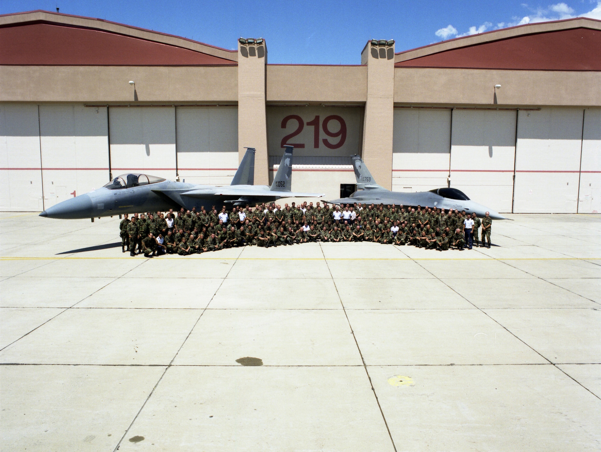 Members of the 173rd Fighter Wing Maintenance Group pose in front of an F-15 Eagle and F-16 Falcon, both bearing the distinct Kingsley tail flash in 1998.  After ten years of teaching F-16 pilots, the Airmen at Kingsley Field converted to an F-15 Schoolhouse and is now the sole F-15C training base for the United States Air Force.  (U.S. Air National Guard file photo) 
