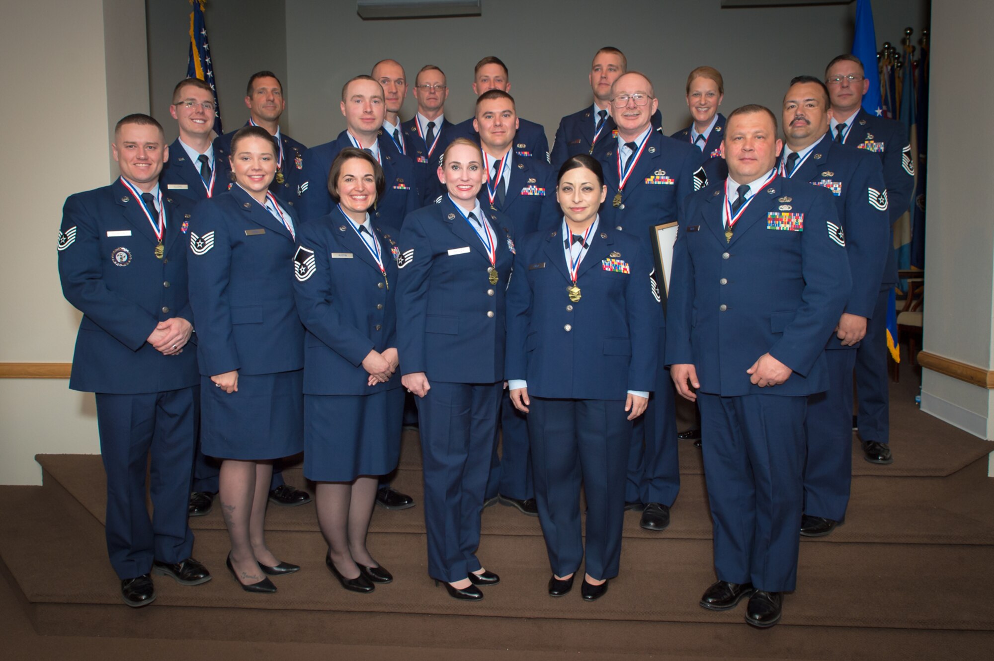 U.S. Air Force airmen with the 153rd Airlift Wing, Wyoming Air National Guard, pose for a picture, May 15, 2016 at F.E. Warren AFB in Cheyenne, Wyoming. The airmen were recognized for earning their Community College of the Air Force Associate in Science degree. (U.S Air National Guard photo by Master Sgt. Charles Delano/released)