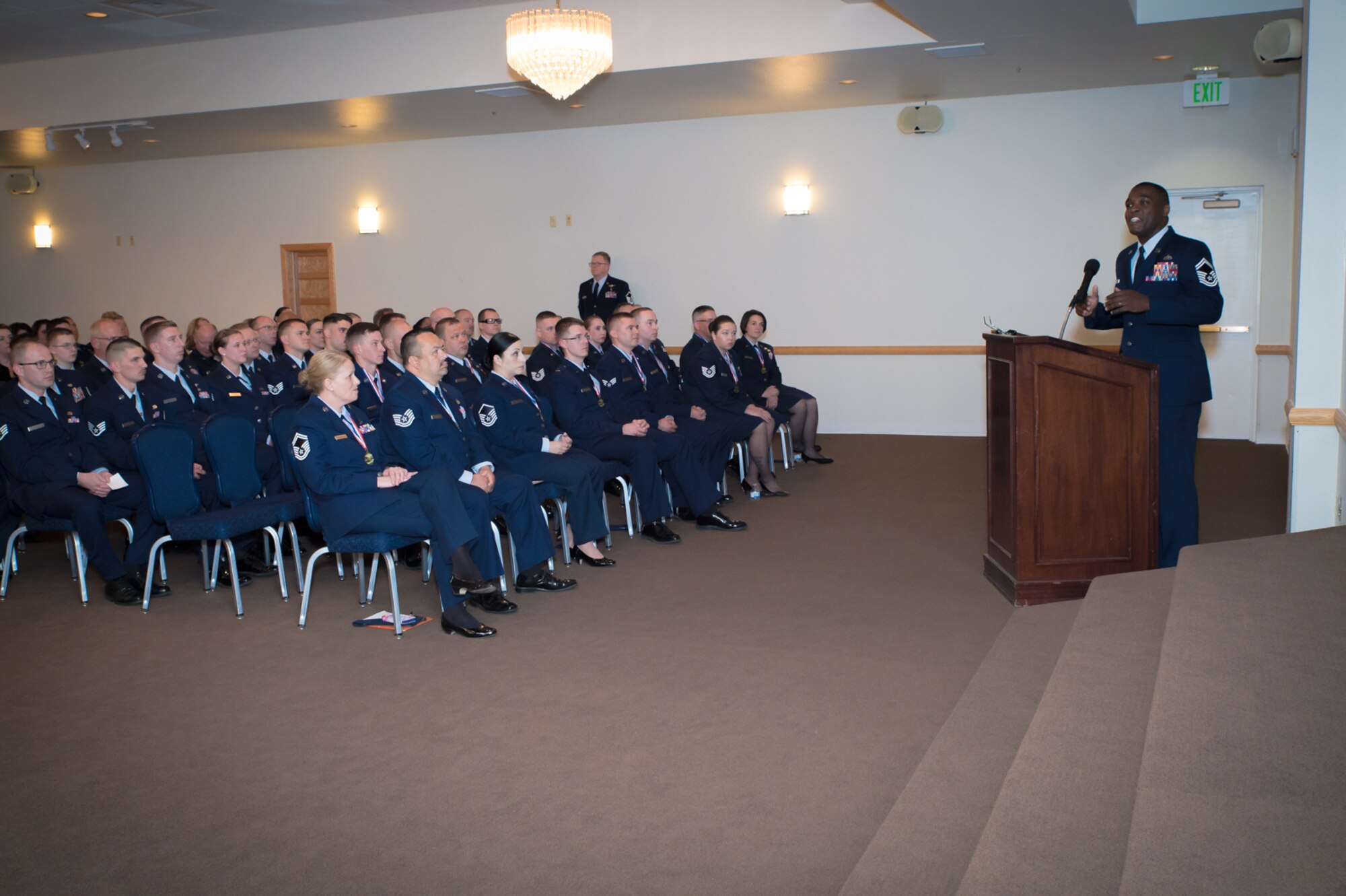 U.S. Air Force Senior Master Sgt. Wendell Snider with the 90th Civil Engineering Squadron, F.E. Warren AFB, gives a speech at a ceremony recognizing recent Community College of the Air Force graduates, recent NCO and Senior NCO inductees, May 15, 2016 at F.E. Warren AFB in Cheyenne, Wyoming. Snider directed his speech to NCOs and Senior NCOs and charged them to go the extra mile and stressed the importance of being an effective leader. (U.S. Air National Guard photo by Master Sgt. Charles Delano/released)