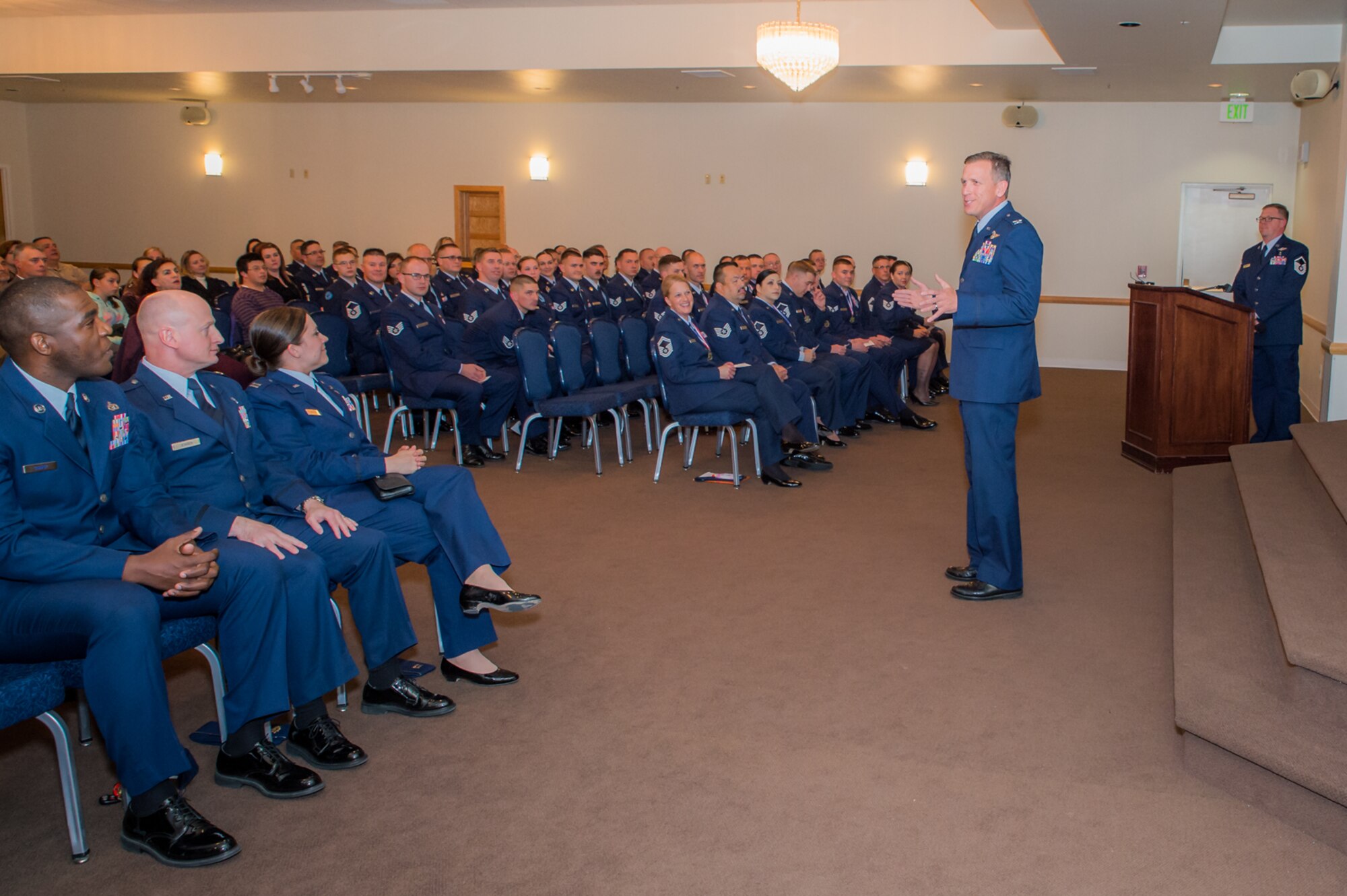 U.S. Air Force Col. Paul Lyman, 153rd Airlift Wing commander, gives the commencement speech at a ceremony recognizing recent Community College of the Air Force graduates, recent NCO and Senior NCO inductees, May 15, 2016 at F.E. Warren AFB in Cheyenne, Wyoming. Lyman spoke about the importance of educational pursuits to mission success. (U.S. Air National Guard photo by Master Sgt. Charles Delano/released)