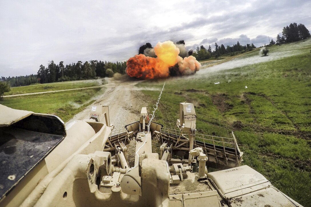 Soldiers detonate the charge to a mine clearing line to remove an obstacle during their gunnery table training at Grafenwoehr Training Area, Germany, May 19, 2016. Army photo by Maj. Randy Ready