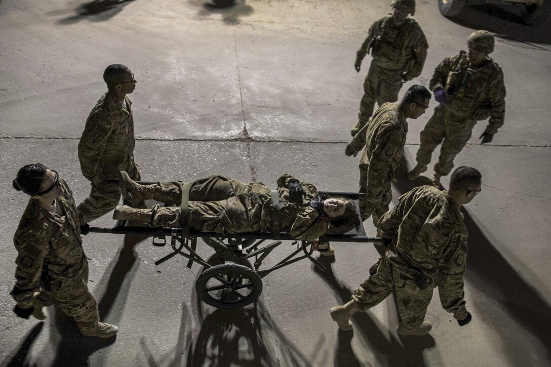 Air Force and Army teams conduct a mass casualty exercise at Bagram Airfield, Afghanistan, May 21, 2016. The airmen are assigned to the 455th Expeditionary Medical Operations Squadron and the soldiers are assigned to the "Dustoff" Medical Evacuation Unit. The exercises prepare first responders to react to an accident or emergency. Air Force photo by Senior Airman Justyn M. Freeman