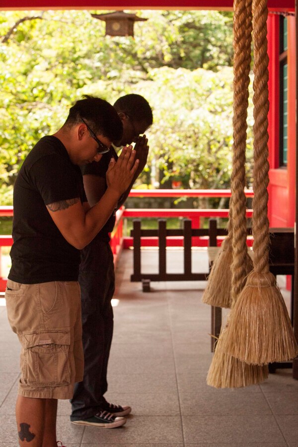 Lance Cpl. Alex Hernandez (front) and Lance Cpl. Devonte Ellis, both with 3rd Battalion, 12th Marine Regiment, visit a Japanese shrine during a cultural tour at Sendai, Japan,  May 24, 2016. The tour occurred during Artillery Relocation Training Program 16-1, a Japan-funded, routine training exercise that allows Marines with 3rd Bn., 12th Marines, 3rd Marine Division, III Marine Expeditionary Force, based out of Camp Hansen, Okinawa, Japan, to conduct live-fire training. Hernandez, an Austin, Tex., native, is a heavy equipment mechanic; Ellis, a New Orleans native, is an embarkation specialist.