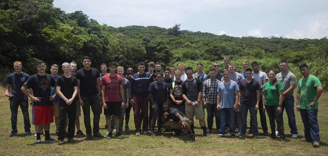 Marines come together for a paintball tournament hosted by the Single Marine Program at White Beach, Okinawa, Japan, May 20, 2016. Participants included engineers and motor transport technicians from III Marine Expeditionary Force Headquarters Group stationed on Camp Hansen competed against Marines from Camp Courtney. (U.S. Marine Corps photo by Lance Cpl. Amaia Unanue/ Released)