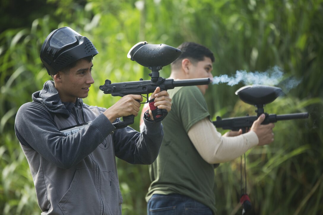 Cpl. Elijah Salazar practices shooting his paintball gun before a tournament hosted by the Single Marine Program at White Beach, Okinawa, Japan, May 20, 2016. Salazar, an Albuquerque, N.M. native, is a financial management resource analyst with III Marine Expeditionary Force Headquarters Group, III MEF. (U.S. Marine Corps photo by Lance Cpl. Amaia Unanue/ Released)