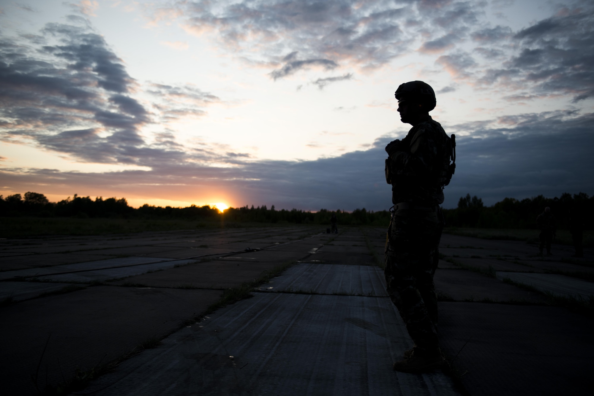 A Deployed Aircraft Ground Response Element team member assigned to the 352d Special Operations Support Squadron stands guard during a Forward Area Refueling Point training as part of TROJAN FOOTPRINT 16 in Pajuostic, Lithuania, May 15, 2016. MC-130J Commando II’s, CV-22 Ospreys, MH-47 Chinook’s and approximately 200 maintenance and support personnel deployed to Powidz, Poland during TF16 for joint, combined training with NATO allies. (U.S. Air Force photo by 1st Lt. Chris Sullivan/Released)