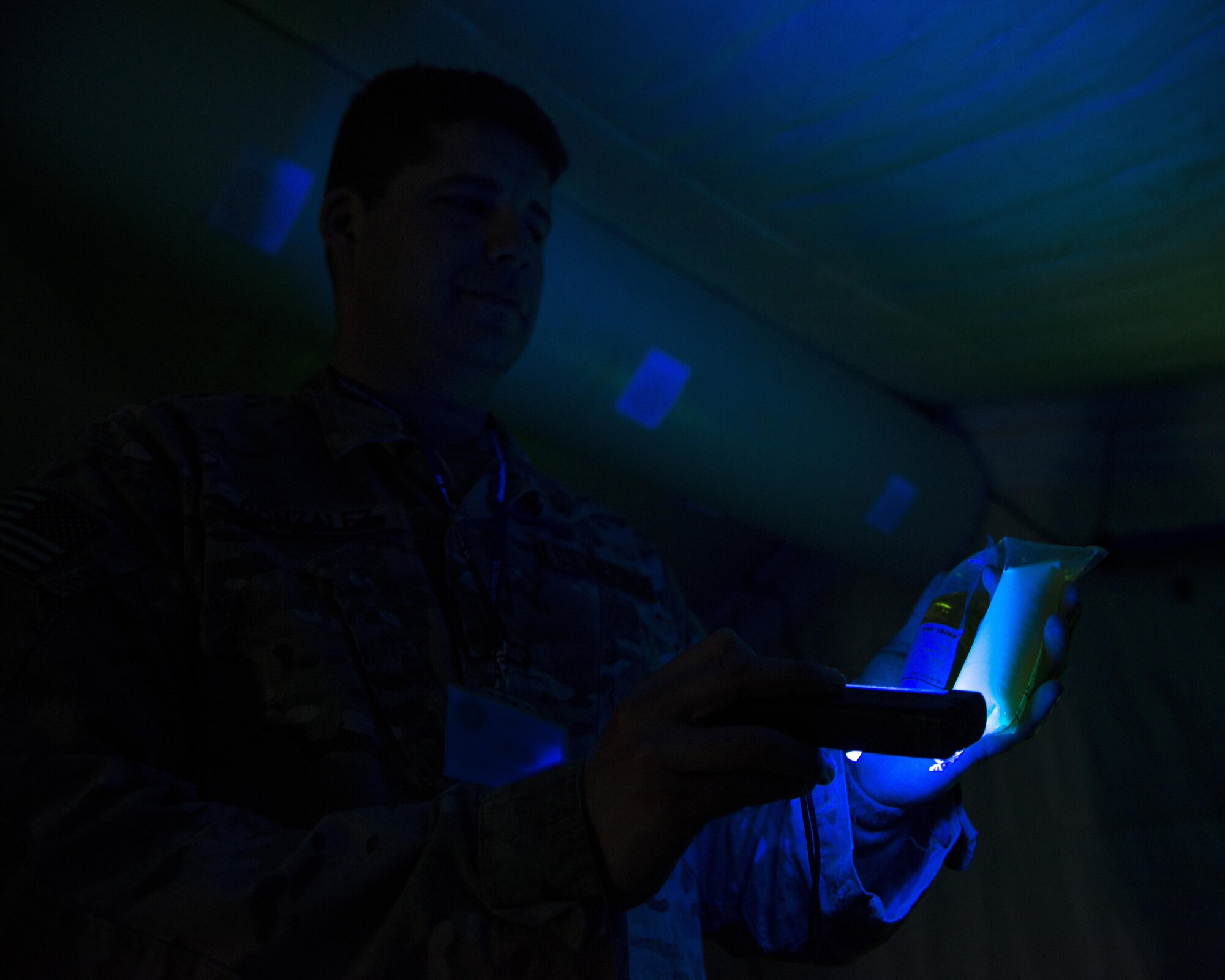 An Independent Duty Medical Technician from the 352d Special Operations Support Squadron tests water samples in Powidz, Poland during TROJAN FOOTPRINT 16, May 18, 2016. Large-scale exercises, such as TF16, require medical personnel to evaluate the working environment both before and during a deployment to maintain the quality of life of assigned personnel. (U.S. Air Force photo by 1st Lt. Chris Sullivan/Released)