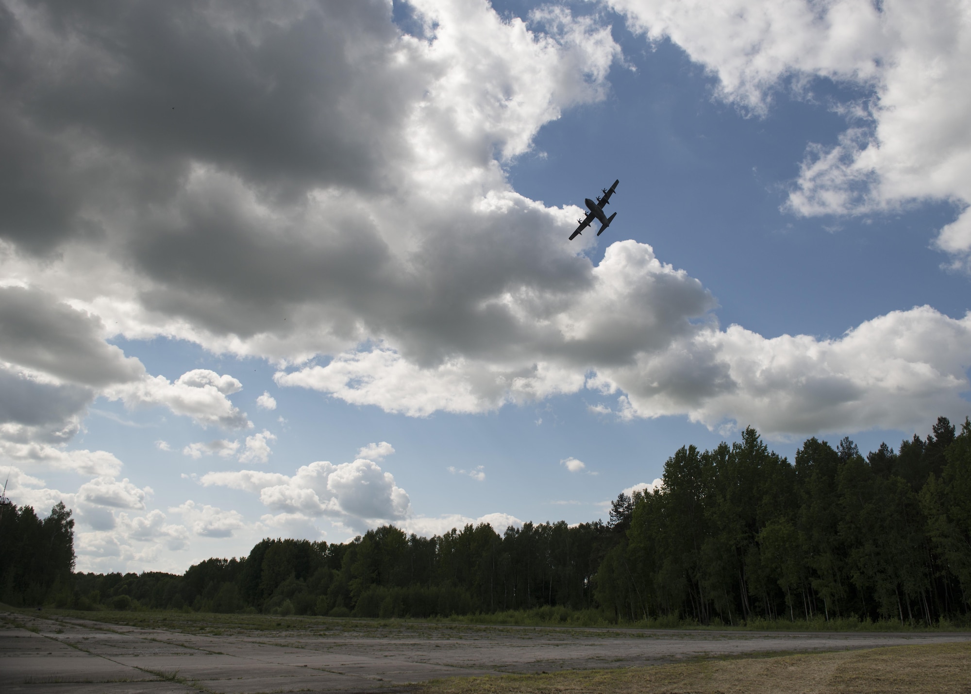 A U.S. MC-130J Commando II from the 352d Special Operations Wing, performs a low level fly-by prior to inserting heavy equipment and personnel during the joint, combined military demo for FLAMING SWORD 16 in Pajuostic, Lithuania, May 20, 2016.  The MC-130J’s were deployed to Powidz, Poland as part of TROJAN FOOTPRINT 16 which rapidly deployed more than 800 Special Operations Forces personnel from NATO and partner nations across the exercise’s training areas to ensure the Alliance and partner nations are able to rapidly assemble and train anywhere they are called to do so. (U.S. Air Force photo by 1st Lt. Chris Sullivan/Released)