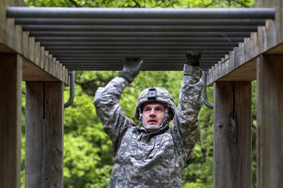 Army Sgt. Sean Salter participates in the horizontal ladder obstacle portion of the 10th Army Air and Missile Defense Command’s 2016 Best Warrior Competition in Baumholder, Germany, May 17, 2016. Air Force photo by Tech. Sgt. Brian Kimball