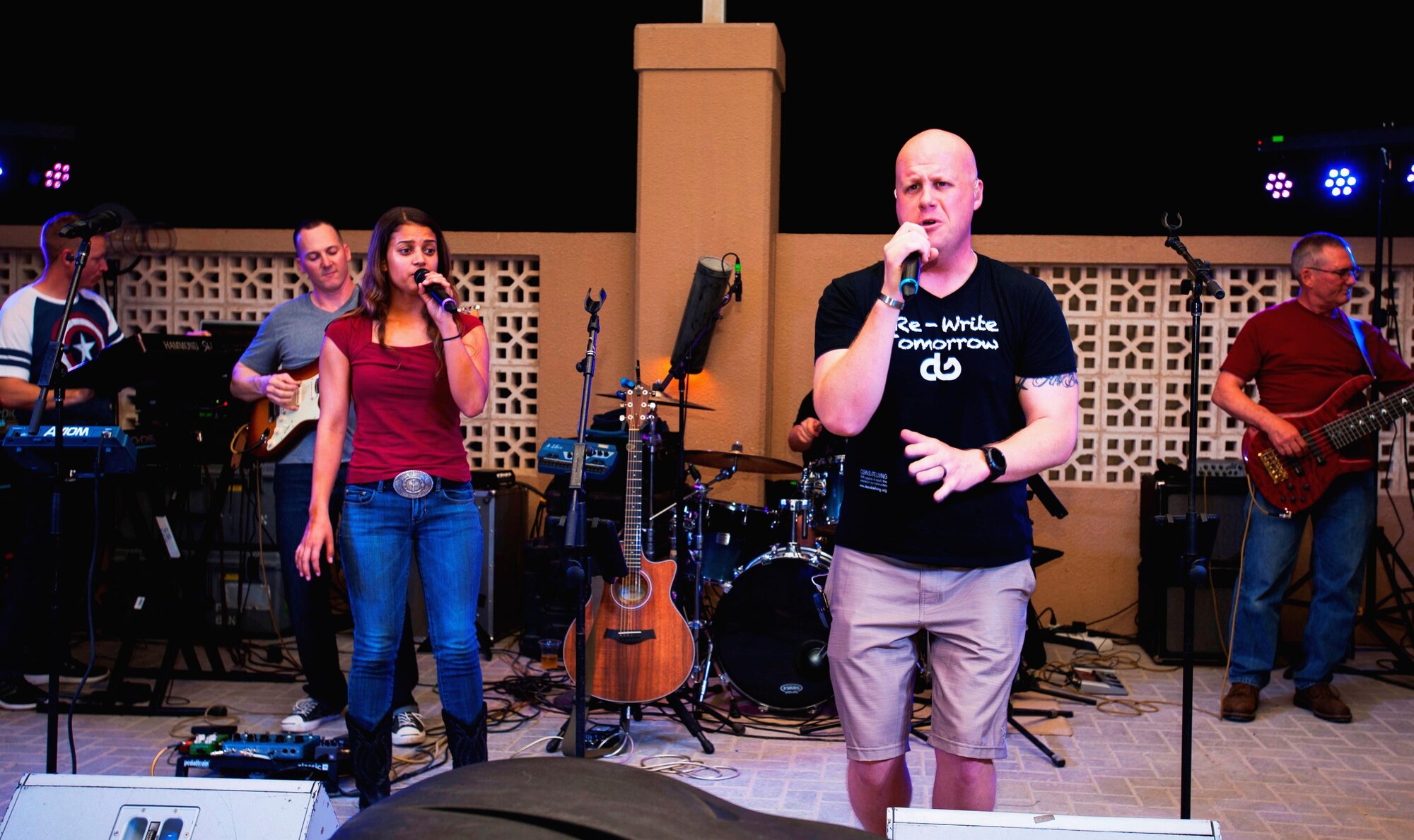 The AFCENT Band, Max Impact, debuted in front of a local Al Udeid audience at an Open Mic Night May 9. The Premier Band from Bolling Air Force Base in Washington, D.C., will be rocking the desert from May to August 2016, bringing a variety of rock and pop tunes to service members, Coalition partners and host-nation community members. (U.S. Army photo by Sgt. 1st Class Patricia Deal)