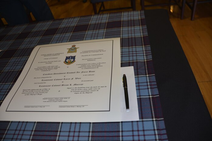 A copy of the Canadian Detachment Change of Command order awaits signature prior to the change of command ceremony May 18. Three copies of the order are presented during the ceremony for signature by the outgoing commander, the Continental U.S. Aerospace Defense Region deputy commander and the new commander. (Air Force Photo released/Mary McHale)