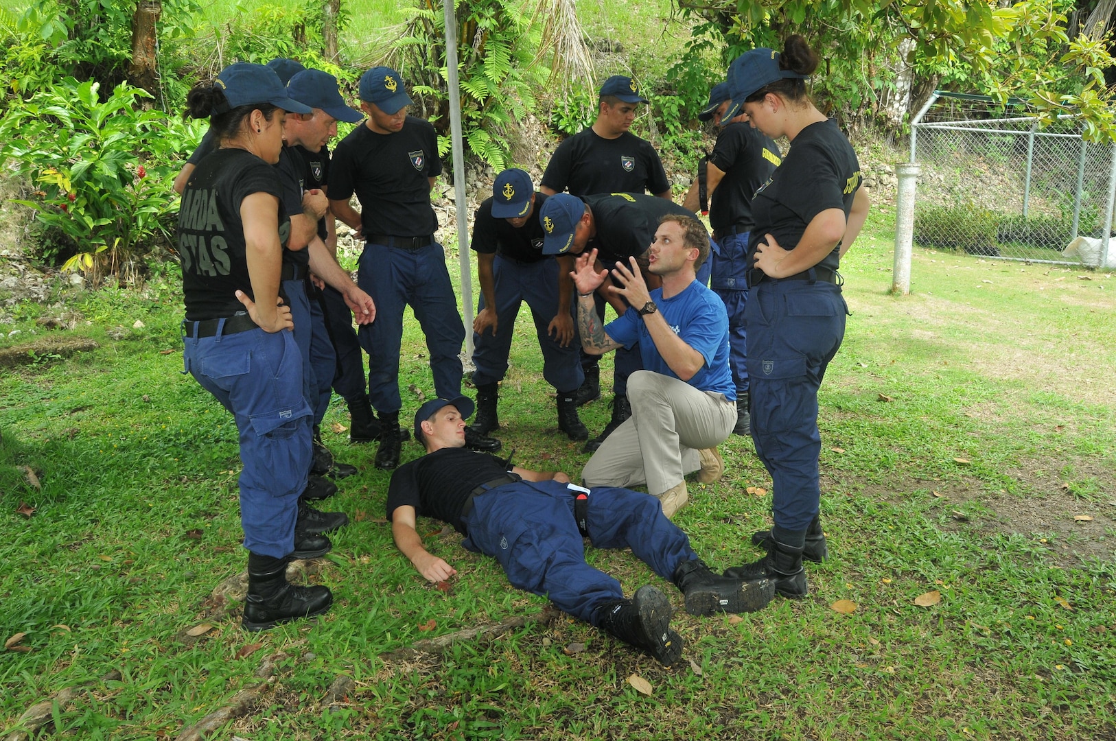 Twenty-two Costa Rican Guarda Costas attended a two-day workshop conducted by Sgt. 1st. Class David Muniz and Sgt. Michael Marfia, medics from New Mexico National Guard, as part of the National Guard Bureau's State Partnership Program. Marfia explains how to properly apply a tourniquet to a leg wound to half of the participants. Muniz and Marfia shared their medical knowledge with the Coast Guard members on topics ranging from anatomy, triage, assessing breathing and consciousness, applying a tourniquet, splinting broken limbs and responding to a mass casualty incident.