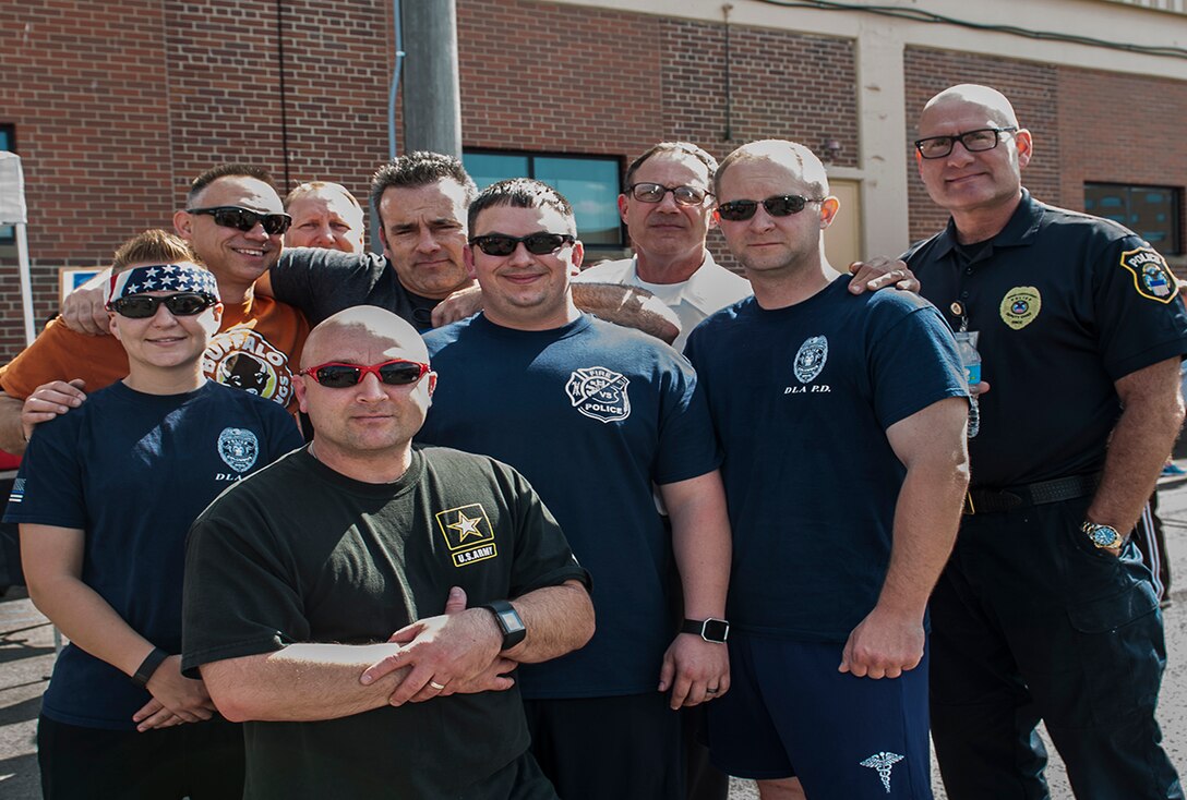 DLA Columbus police officers gather before the Memorial 5k run/walk event May 19 outside the fitness center at Defense Supply Center Columbus. The race was part of the week-long activities on the installation to celebrate Police Week. 