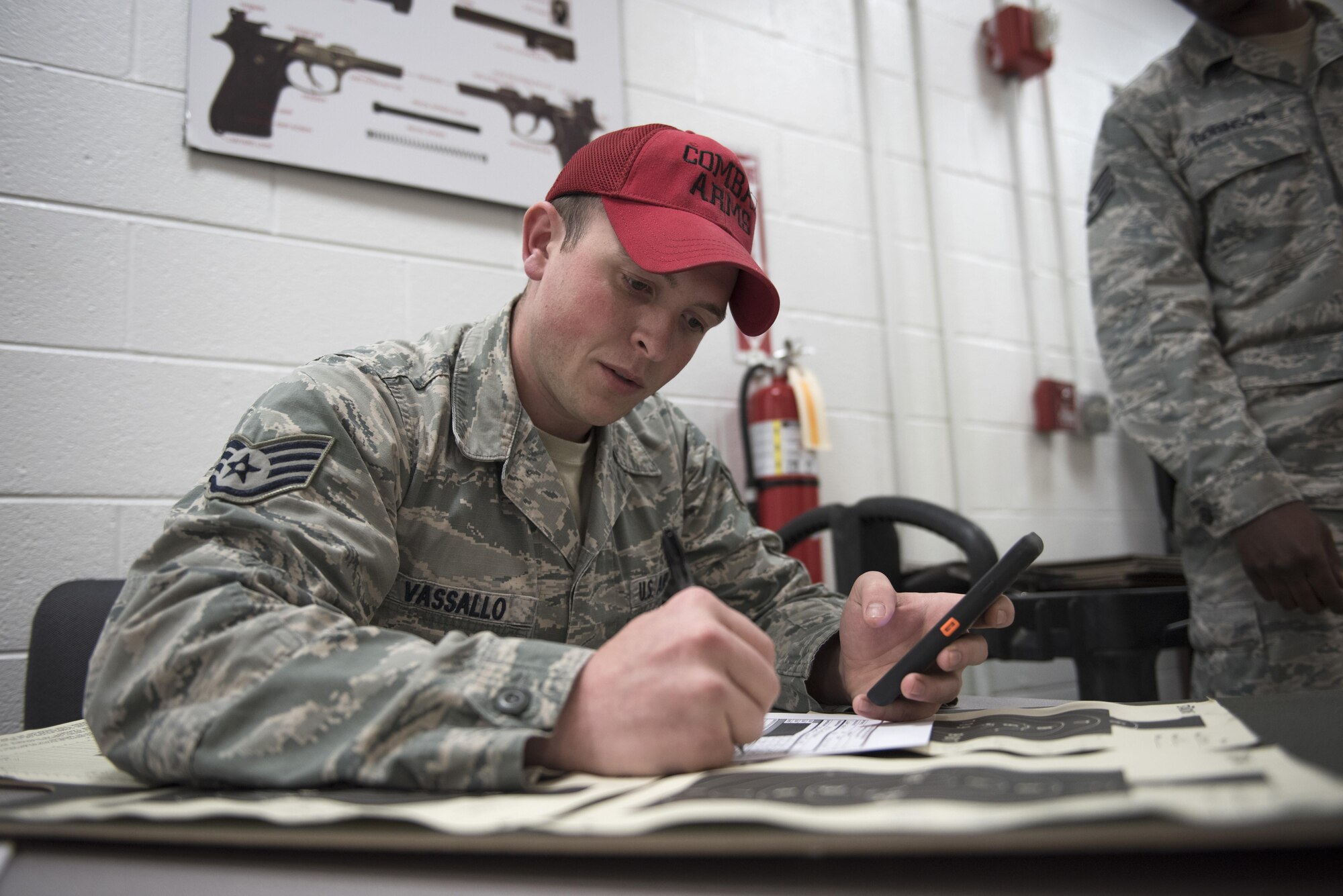 Staff Sgt. Alfred Vassallo, chief statistical officer, calculates scores of participants during the 2016 Elementary Level Excellence in Competition Rifle Match at Joint Base Andrews, Md., May 17. The EIC had 120 participants from active duty, the Guard and Reserve, and was one of several events on base celebrating National Police Week. (U.S. Air Force photo by Airman 1st Class Philip Bryant)