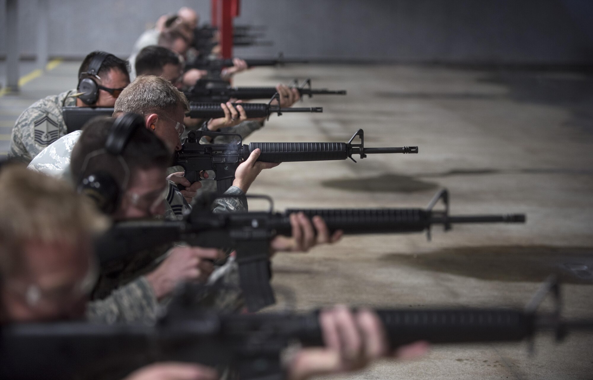 Airmen shoot downrange during the 2016 Elementary Level Excellence in Competition Rifle Match at Joint Base Andrews, Md., May 17. The EIC had 120 participants from active duty, the Guard and Reserve, and was one of several events on base celebrating National Police Week. (U.S. Air Force photo by Airman 1st Class Philip Bryant)