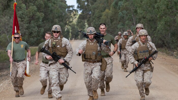 Marines with the Marine Corps Shooting Team run during the section match May 17, 2016 at Puckapunyal Military Area, Victoria, Australia. The event is part of Australian Army Skill at Arms Meeting 2016, a competitive marksmanship event that evaluates the shooting skills of the competitors. The section match consisted of two running portions and two firing portions where teams were evaluated on both skill and swiftness as a marksman.