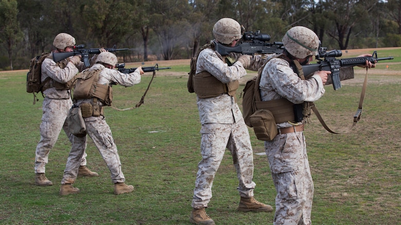 Marines with the Marine Corps Shooting Team fire rounds down range during the section match May 17, 2016 at Puckapunyal Military Area, Victoria, Australia. The event is part of Australian Army Skill at Arms Meeting 2016, a competitive marksmanship event that evaluates the shooting skills of the competitors. The section match consisted of two running portions and two firing portions where teams were evaluated on both skill and swiftness as a marksman.