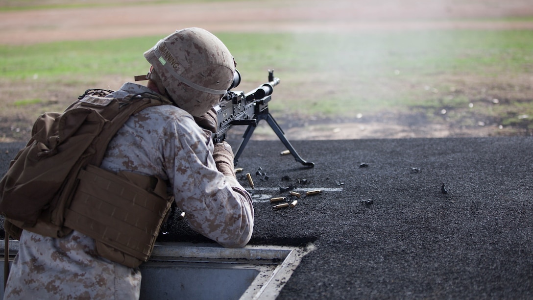 Cpl. Zachary Banning, a competitor with the Marine Corps Shooting Team, fires an M240B during the section match May 17, 2016 at Puckapunyal Military Area, Victoria, Australia. The event is part of Australian Army Skill at Arms Meeting 2016, a competitive marksmanship event that evaluates the shooting skills of the competitors. The section match consisted of two running portions and two firing portions where teams were evaluated on both skill and swiftness as a marksman.