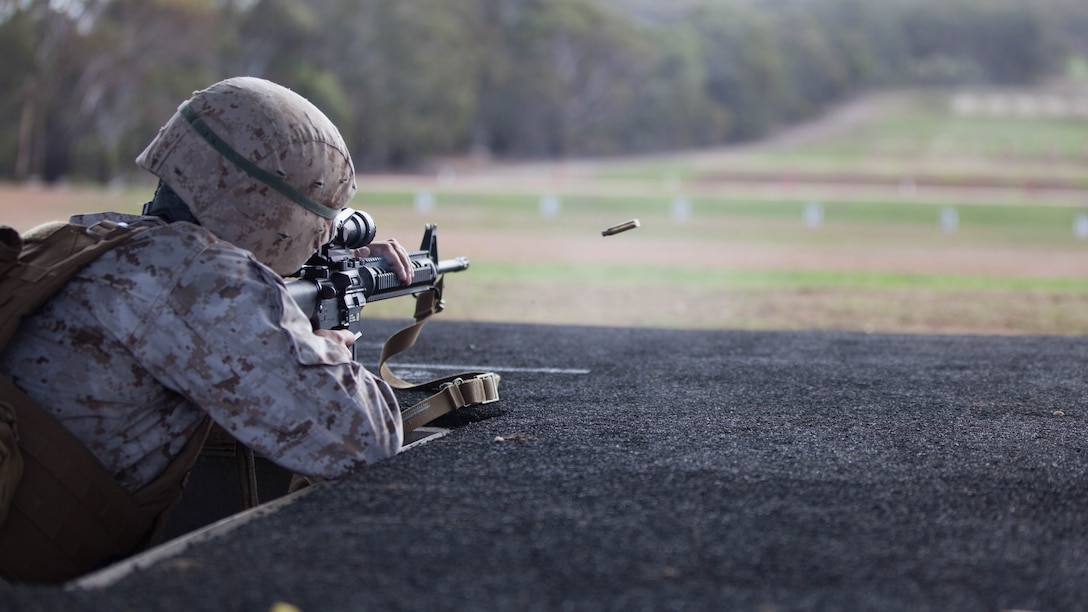 Sgt. Jose Arroyo, a competitor with the Marine Corps Shooting Team, fires his M16A4 service rifle during the section match May 17, 2016 at Puckapunyal Military Area, Victoria, Australia. The event is part of Australian Army Skill at Arms Meeting 2016, a competitive marksmanship event that evaluates the shooting skills of the competitors. The section match consisted of two running portions and two firing portions where teams were evaluated on both skill and swiftness as a marksman.