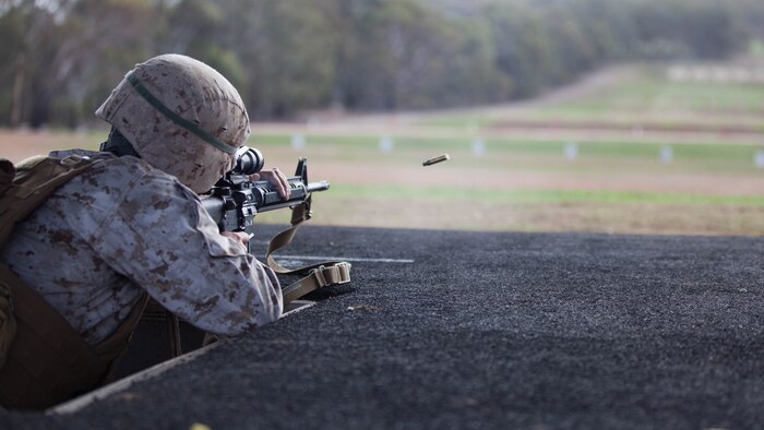 Sgt. Jose Arroyo, a competitor with the Marine Corps Shooting Team, fires his M16A4 service rifle during the section match May 17, 2016 at Puckapunyal Military Area, Victoria, Australia. The event is part of Australian Army Skill at Arms Meeting 2016, a competitive marksmanship event that evaluates the shooting skills of the competitors. The section match consisted of two running portions and two firing portions where teams were evaluated on both skill and swiftness as a marksman.