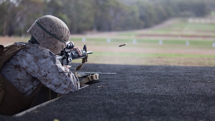 Sgt. Jose Arroyo, a competitor with the Marine Corps Shooting Team, fires his M16A4 service rifle during the section match May 17, 2016 at Puckapunyal Military Area, Victoria, Australia. The event is part of Australian Army Skill at Arms Meeting 2016, a competitive marksmanship event that evaluates the shooting skills of the competitors. The section match consisted of two running portions and two firing portions where teams were evaluated on both skill and swiftness as a marksman.