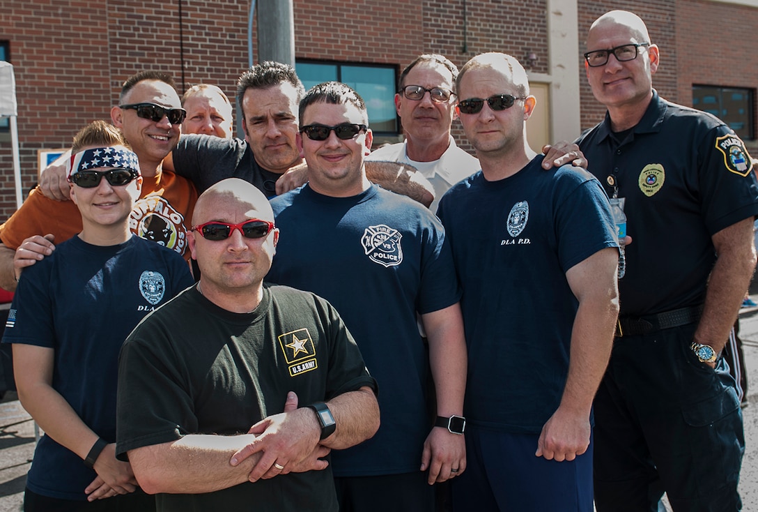 DLA Columbus police officers gather before the Memorial 5k run/walk event May 19 outside the fitness center at Defense Supply Center Columbus. The race was part of the week-long activities on the installation to celebrate Police Week. 