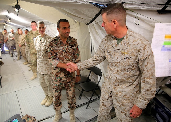 Lieutenant Gen. William D. Beydler, commander, U.S. Marine Corps Forces Central Command, meets with Jordanian Armed Forces Lt. Col. Moh'd Al-Masri and U.S. Marine Corps Maj. Tera Denial, at the Combined Joint Task Force logistical officers for Exercise Eager Lion 2016, at the Joint Training Center, just outside Amman, Jordan, May 24.  Eager Lion 16 is a bilateral exercise with the Hashemite Kingdom of Jordan designed to strengthen military-to-military relationships, increase interoperability between partner nations and enhance regional security and stability.
