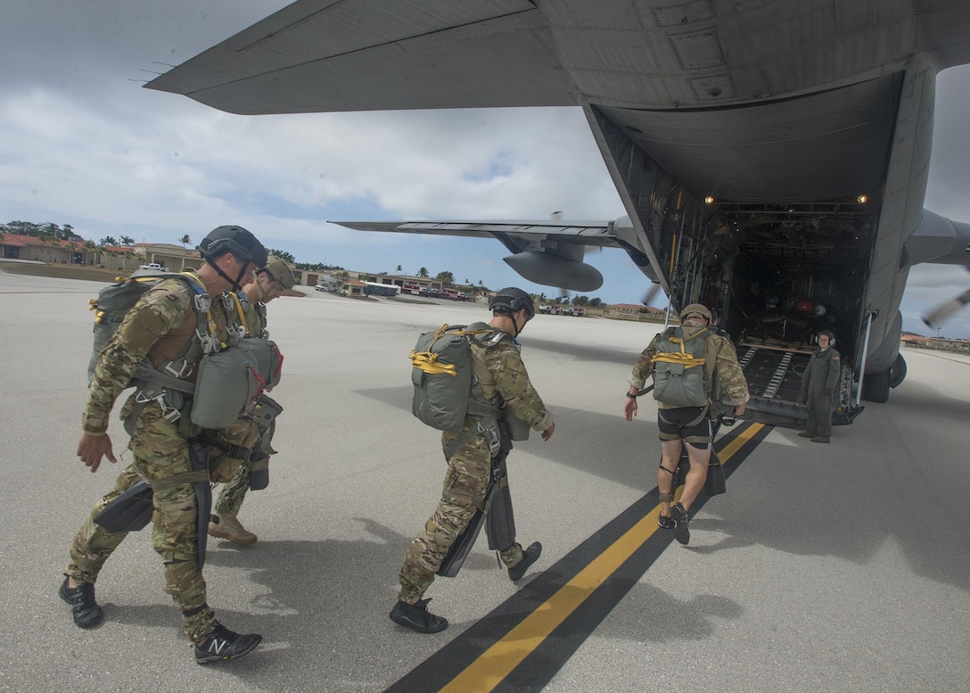 Sailors board a C-130 Hercules aircraft at Anderson Air Force Base, Guam, May 18, 2016, before participating in a combat rubber raiding craft insertion as part of exercise Tricrab. The sailors are assigned to Explosive Ordnance Disposal Mobile Unit 5. Tricrab focuses on strengthening relationships within the Asia-Pacific region through training and information exchanges to enhance explosive ordnance disposal and diving-related interoperability. Navy photo by Petty Officer 1st Class Doug Harvey