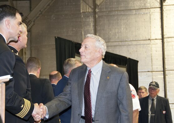 A Vietnam veteran shakes hands with Capt. Mike Steffen, Naval Air Station Fort Worth Joint Reserve Base, Texas commander, after receiving a lapel pin during the Vietnam War Veterans Recognition Ceremony in a hangar here, April 22. The Vietnam Veteran lapel pin honors the service and sacrifice of all who served on active duty in the U.S. Armed Forces from Nov. 1, 1955 to May 15, 1975. (U.S. Air Force photo by Staff Sgt. Melissa Harvey)