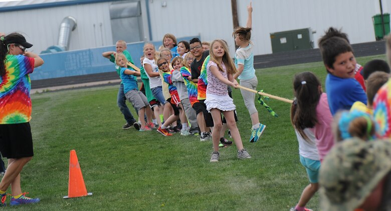 Ellicott Elementary School kids compete in a tug-o-war match at the end of a field days event in Ellicott, Colorado, Tuesday, May 24, 2016. Different classes competed against each other concluding with an adults-only match. (U.S. Air Force photo/Airman William Tracy) 