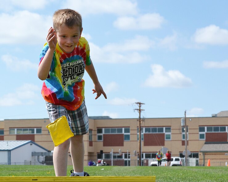 Ethan Buckholdt, Ellicott Elementary student, throws a bean bag during field days at Ellicott, Colorado, Tuesday, May 24, 2016. The annual three-day event serves as a way to reward students for their hard work during the school year and as a celebration for the start of summer. (U.S. Air Force photo/Brian Hagberg)