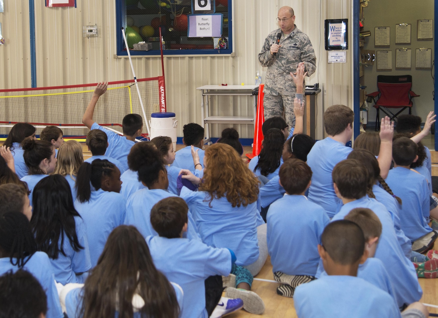 Col. Michael Gimbrone, 502nd Security Forces Logistics Support Group commander, give a mission brief to Randolph Elementary School students during Operation Flags at Randolph Elementary May 18, 2016. Gimbrone gave the students a brief about the pre-deployment, deployment and the re-integration process they were about to participate in. (U.S. Air Force courtesy photo/RELEASED)