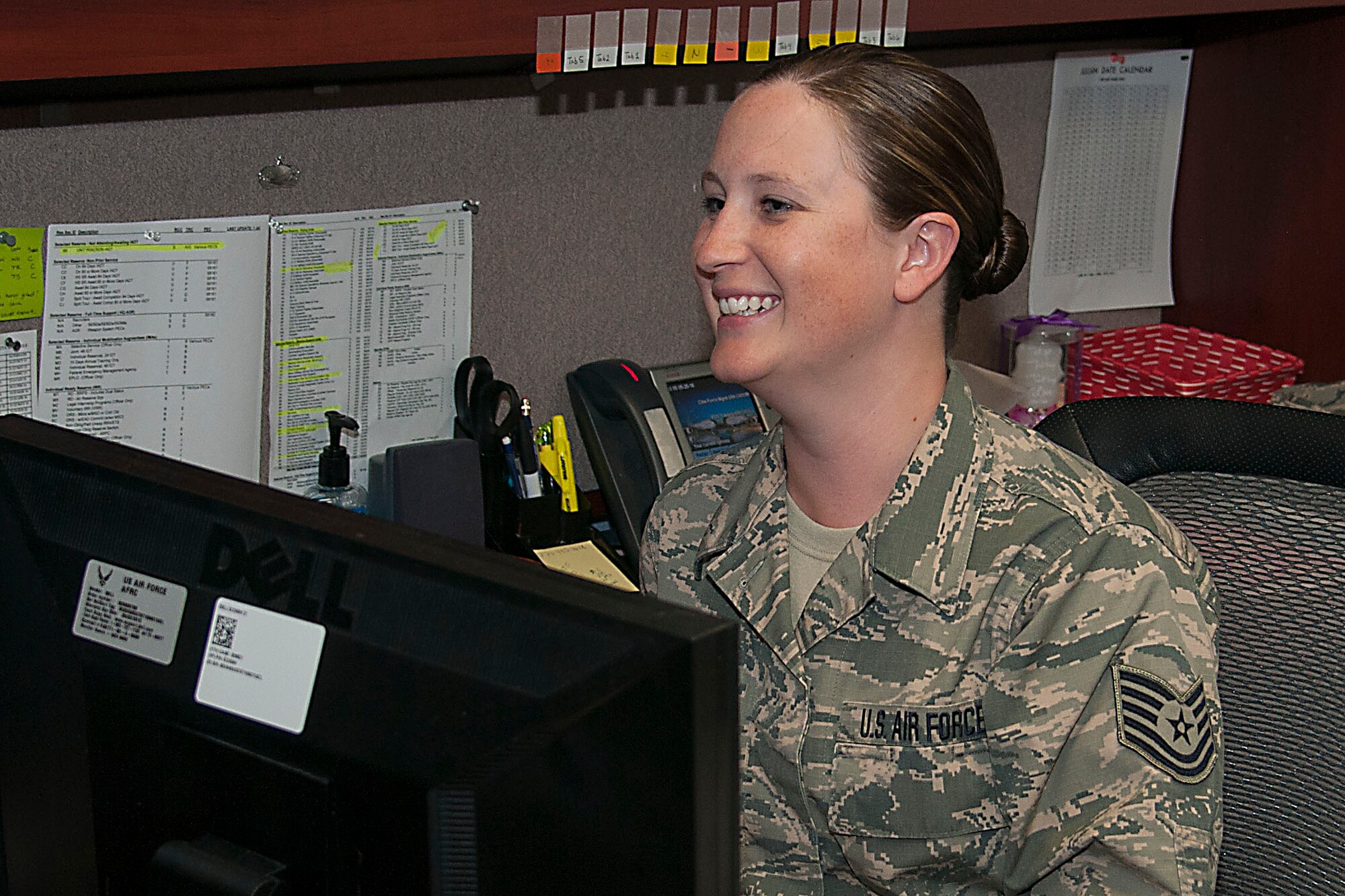 Tech. Sgt. Erica Sherwood, 434th Force Support Squadron, laughs with her coworkers May 25, 2016 at Grissom Air Reserve Base, Ind. Sherwood was recently awarded the Force Support Noncommissioned Officer of the Year Award. (U.S. Air Force photo/Senior Airman Dakota Bergl) 