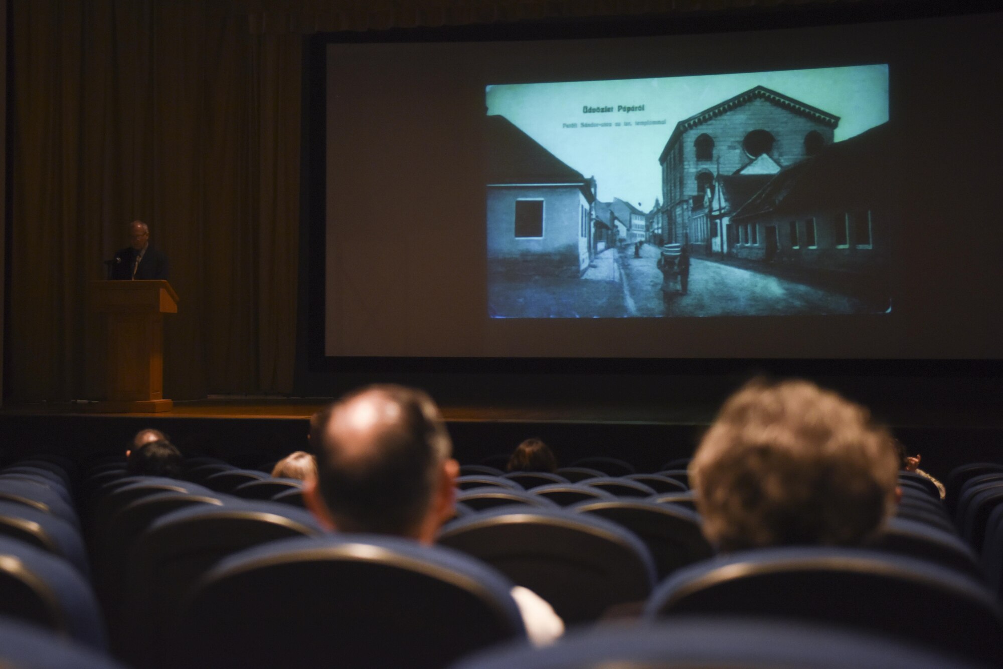 Dr. John Garrett, 17th Training Wing Base Historian, gives a presentation on the Holocaust at the Base Theater on Goodfellow Air Force Base, May 24, 2016. The seminar educated attendees about the severity of the holocaust casualties. (U.S. Air Force photo by Airman 1st Class Chase Sousa/Released)