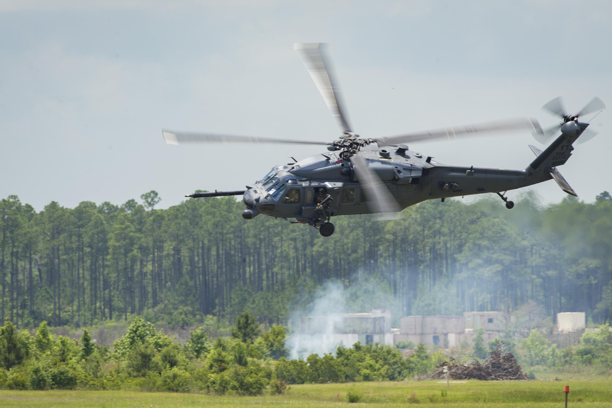 An HH-60G Pave Hawk maneuvers over Grand Bay Bombing and Gunnery Range at Moody Air Force Base, Ga., May 19, 2016. Multiple U.S. Air Force aircraft within Air Combat Command conducted joint aerial training showcasing the aircraft’s tactical air and ground maneuvers, as well as its weapons capabilities. (U.S. Air Force photo by Airman Daniel Snider/Released)
