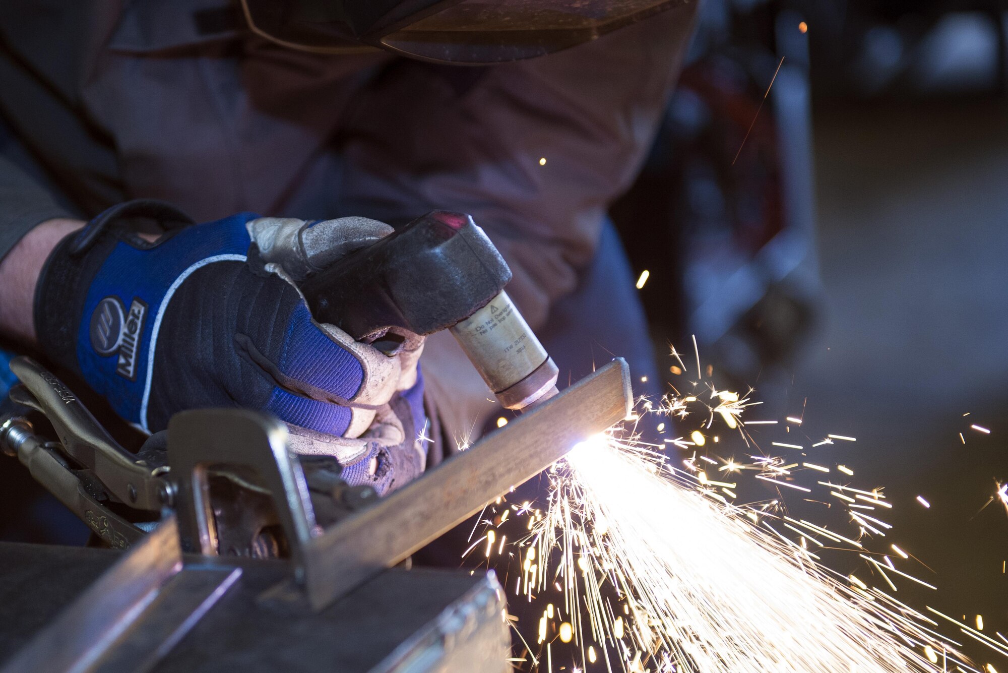 U.S. Air Force Airman 1st Class Joshua Tears-Knapp, 23d Equipment Maintenance Squadron aircraft metals technology journeyman, uses a plasma cutter to weld a piece of metal, March 18, 2016, at Moody Air Force Base, Ga. Metals technology technicians are responsible for fabricating and repairing aircraft parts and equipment. (U.S. Air Force photo by Airman 1st Class Greg Nash/Released) 